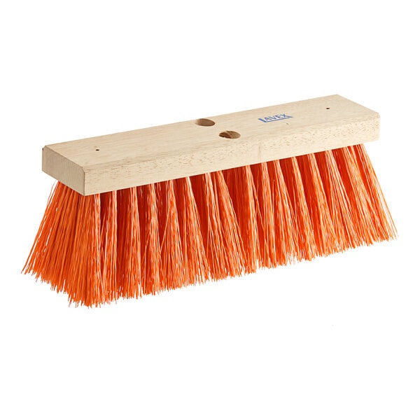 A close-up of a Lavex wood broom head with orange bristles.