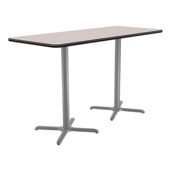 A rectangular National Public Seating bar height table with a gray surface and gray metal legs in an X shape.
