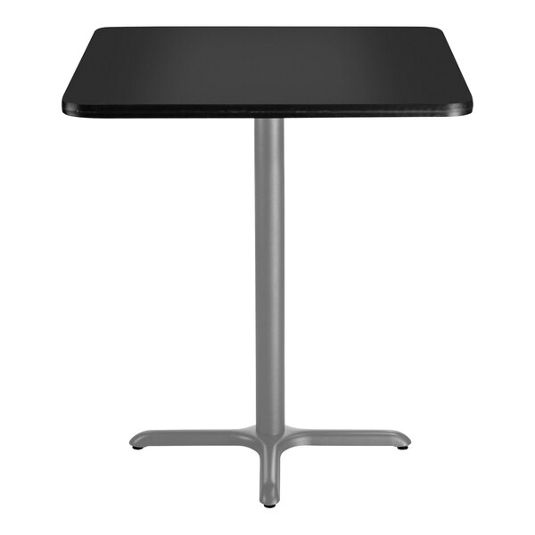 A black square National Public Seating bar height table with a gray metal X base.