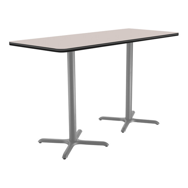 A rectangular National Public Seating bar height table with a gray surface and metal X base.