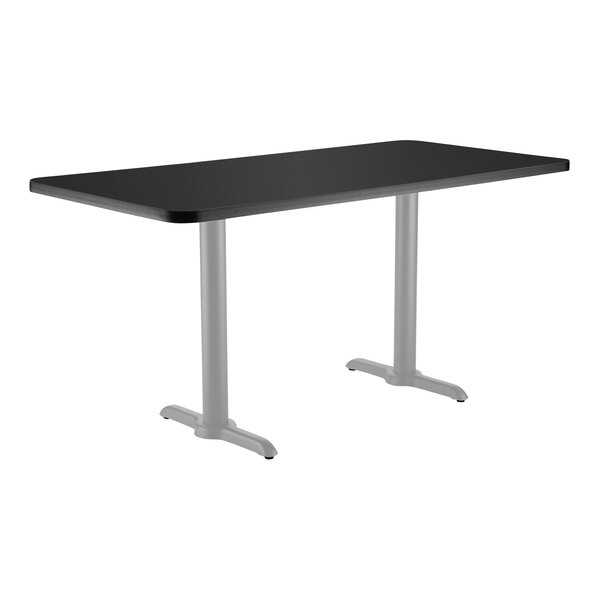 A black rectangular National Public Seating cafe table with two gray metal T bases.