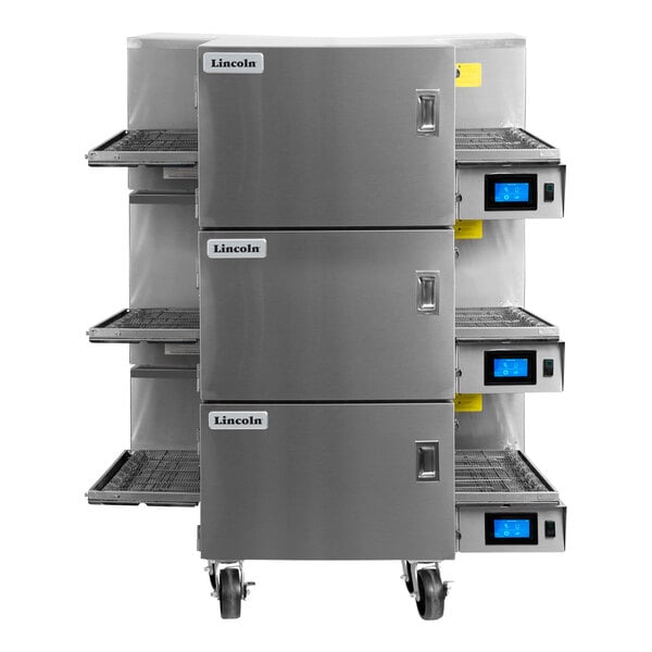 A Lincoln Aperion triple stacked conveyor oven with three tiers of conveyor racks.