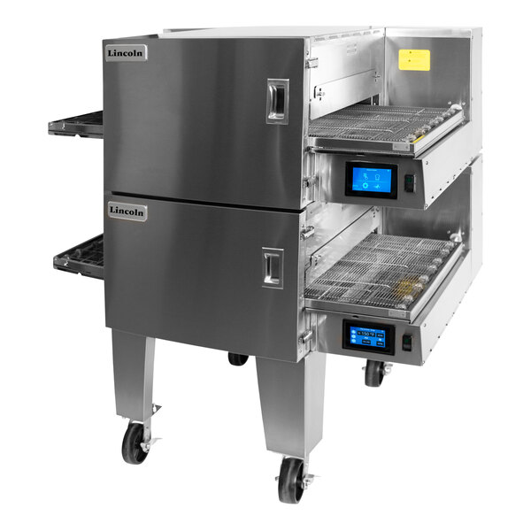 A double stacked stainless steel electric conveyor oven with digital controls and mesh belts, designed for commercial kitchens.