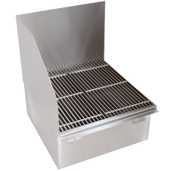 A stainless steel floor mounted mop sink with removable metal grating over a drain.