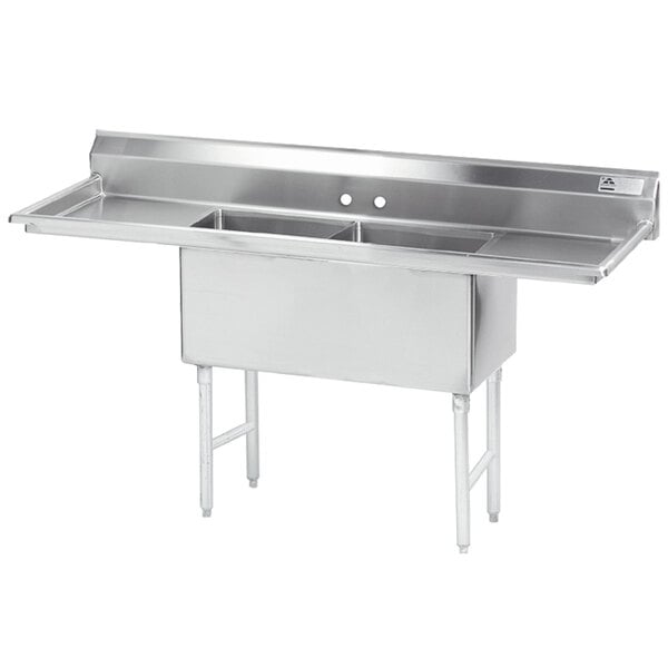 An Advance Tabco stainless steel two compartment sink with two 24" drainboards.