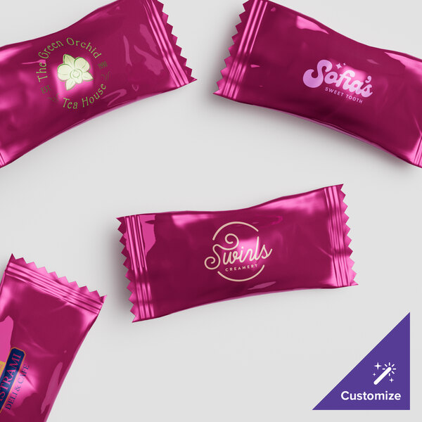 A group of white customizable buttermints with burgundy wrappers.