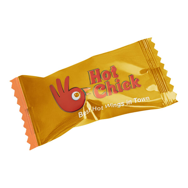 A small yellow packet with red text and a red hand.