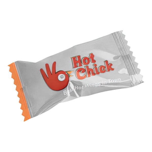 A close up of a case of individually wrapped Cinnamon Starlites with a white wrapper.