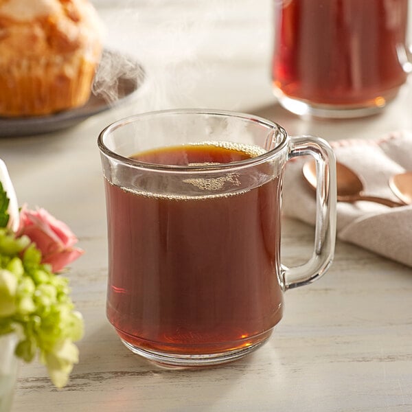 A glass mug of Crown Beverages Organic Guatemalan Whole Bean Coffee.