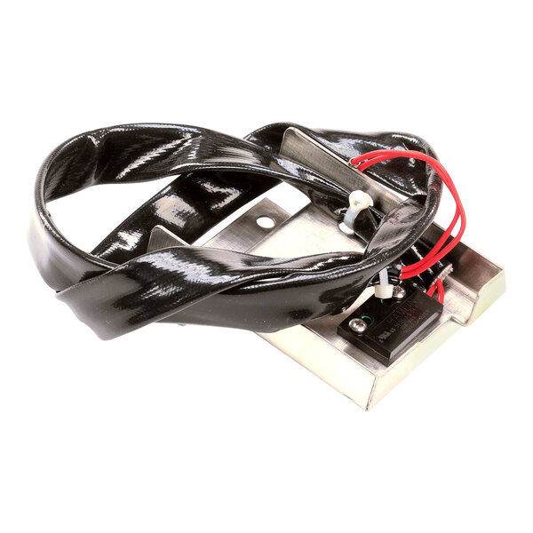 A black and silver metal device with a black strap and red wire harness.