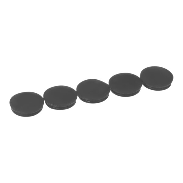 A row of black plastic Spaceman bolt hold covers with black circles.