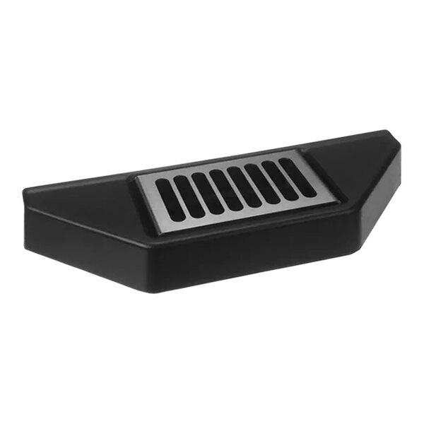 A black plastic Spaceman front drip tray with a metal grate over a vent.