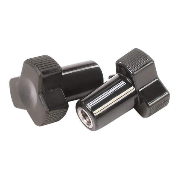 A pair of small black plastic knobs with a screw.