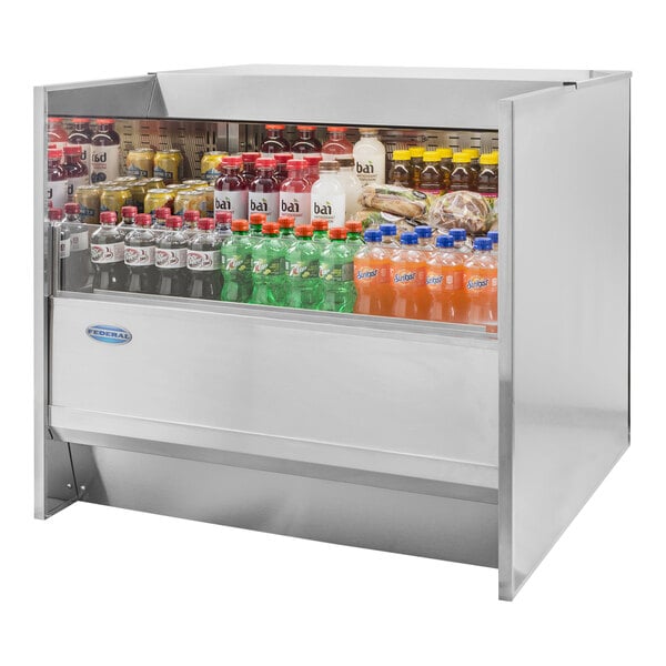 A black Federal Industries Slim-Line refrigerated display case on a counter with bottles of soda and other beverages inside.
