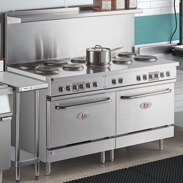 A large stainless steel Cooking Performance Group electric range with pots on top.