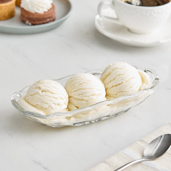 A glass bowl with a scoop of Eclipse Foods vegan dairy-free ice cream.