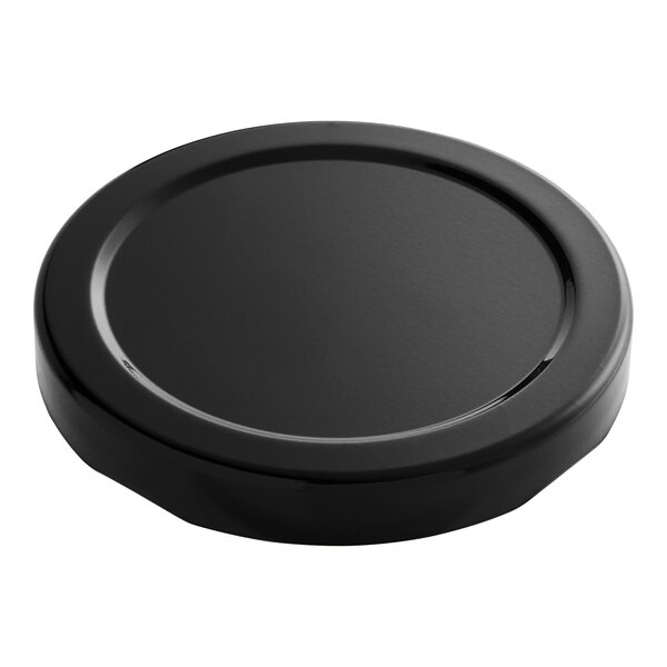 A black metal lid with a plastisol liner on a white background.
