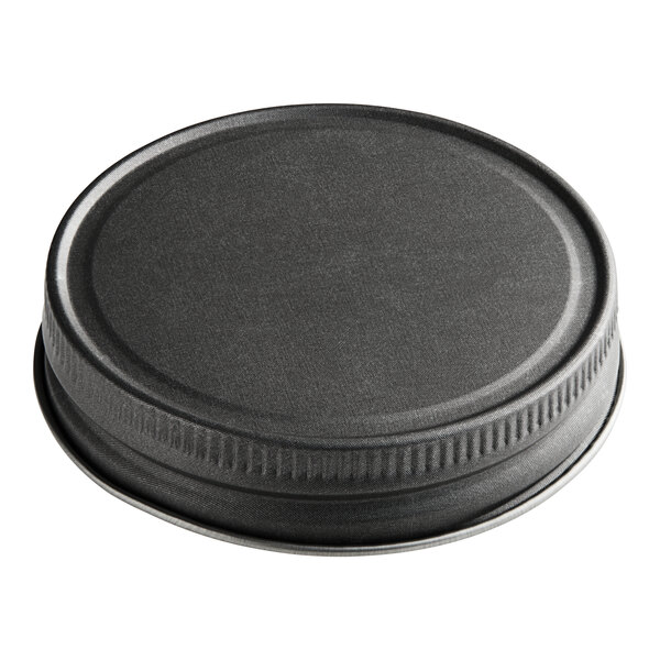 A 70/450 Pewter Gray metal lid with a metal rim.