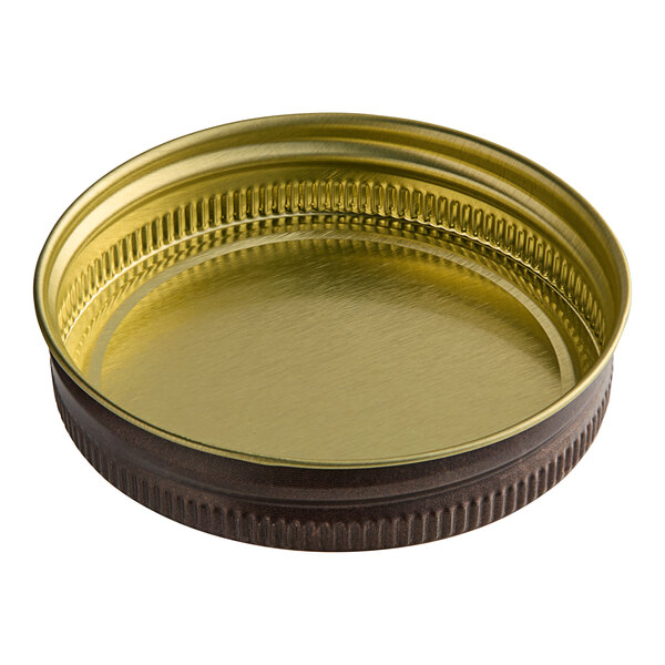A rustic brown metal lid with a black rim.