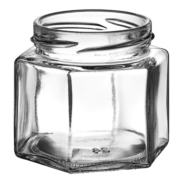 A 4 oz. clear glass hex jar with a lid.
