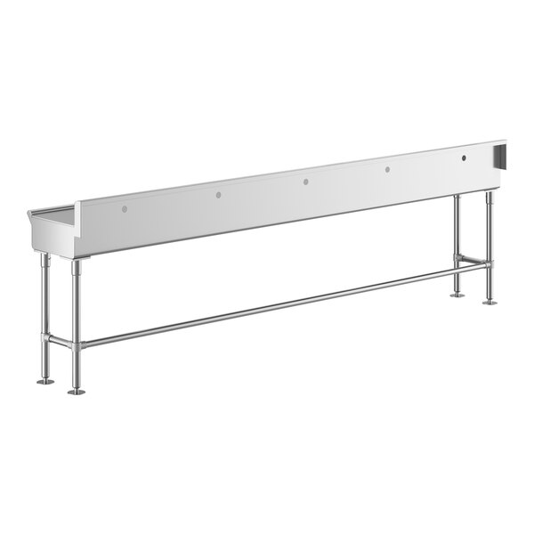 A long stainless steel Regency hand sink with metal legs.