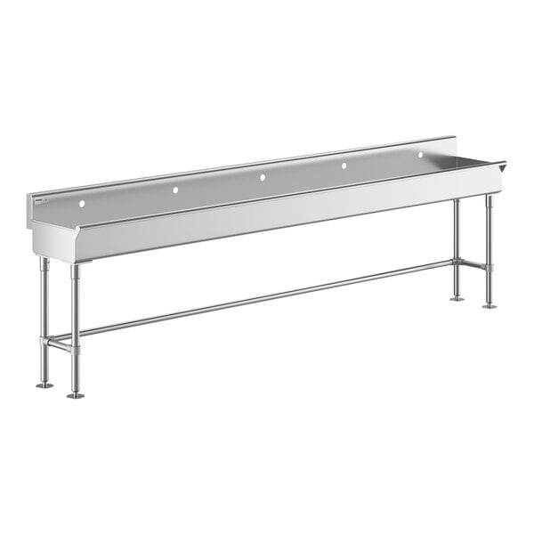 A stainless steel Regency hand sink with a long metal shelf and a metal frame with holes.