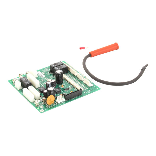 A green Henny Penny input/output circuit board with a red wire attached.