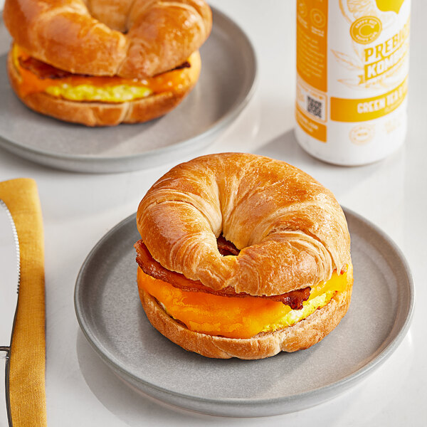 A breakfast sandwich on a Pillsbury Fully Baked Sliced Croissant Bun.