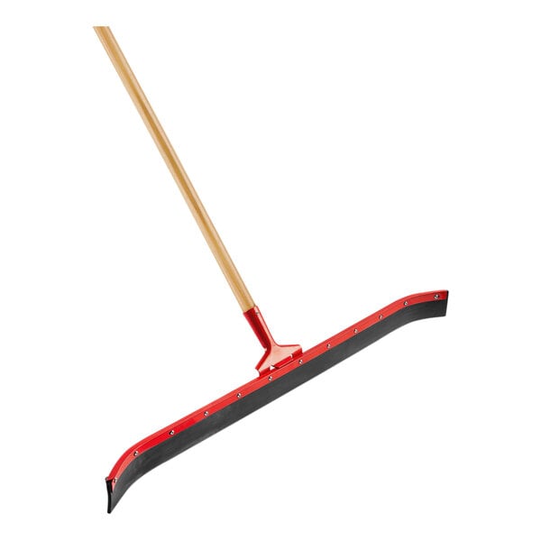A red and black Libman curved floor squeegee with a wooden handle.