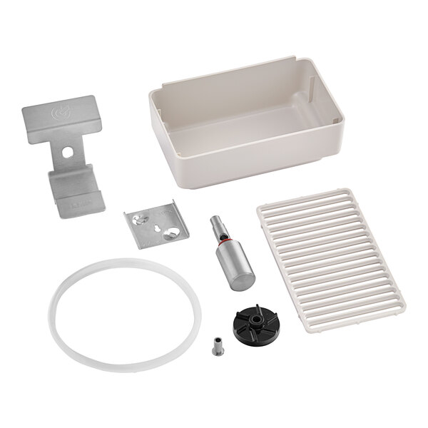 A white plastic rectangular box with a round white object and a metal clip.