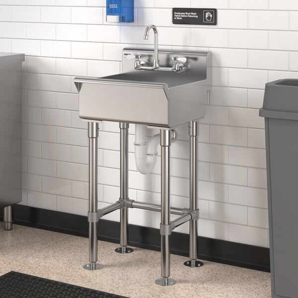 A stainless steel Regency hand sink with a faucet above it.