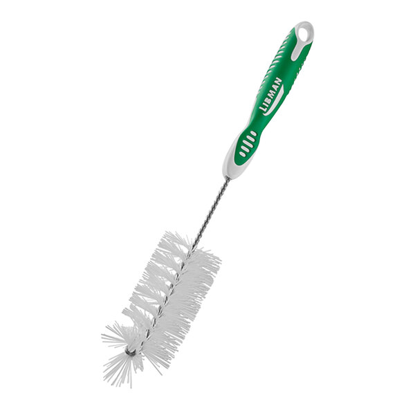 A close up of a white Libman bottle brush with a green handle.