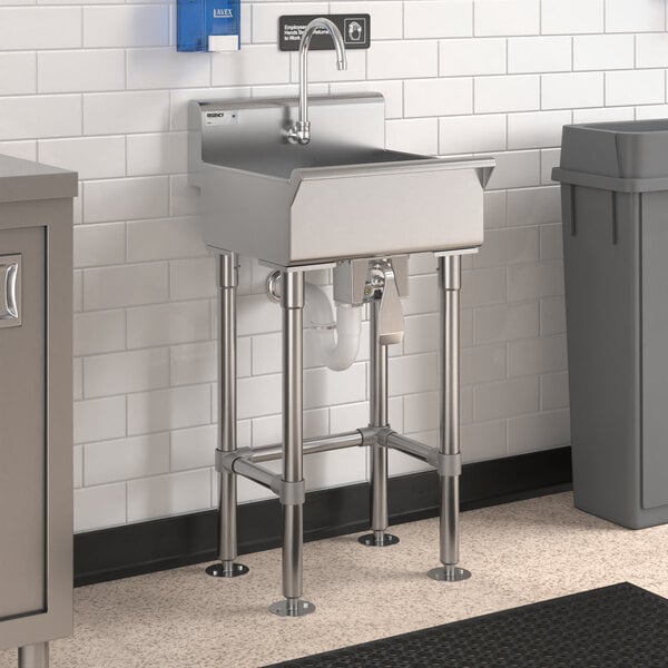 A stainless steel Regency hand sink with a knee-operated faucet.