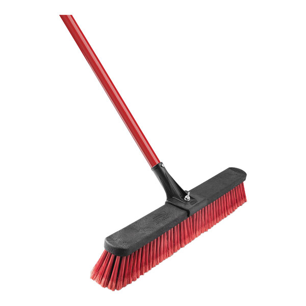 A red Libman multi-surface push broom with black and red handle.