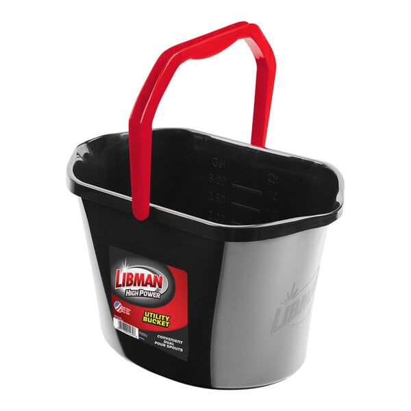 A black bucket with red handles.