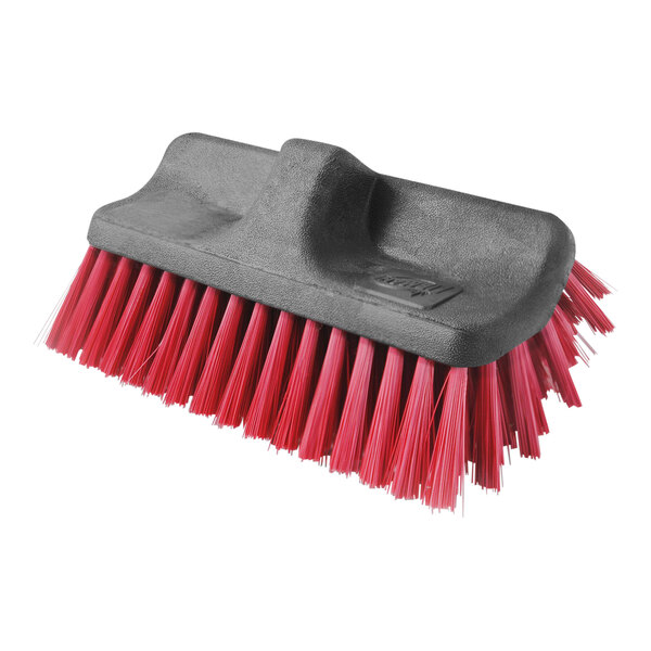 A close-up of a red and black Libman dual-sided scrub brush head.