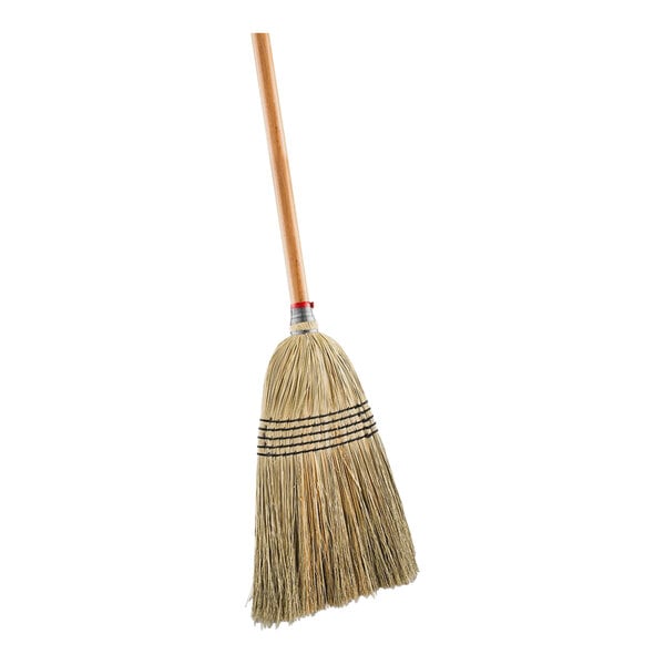 A close up of a Libman Janitor Corn Broom with a wooden handle.