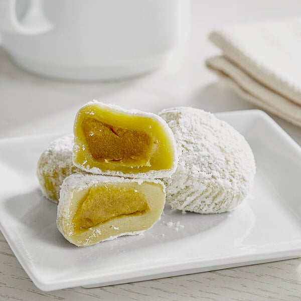 A white plate with three sugar cookies on it.