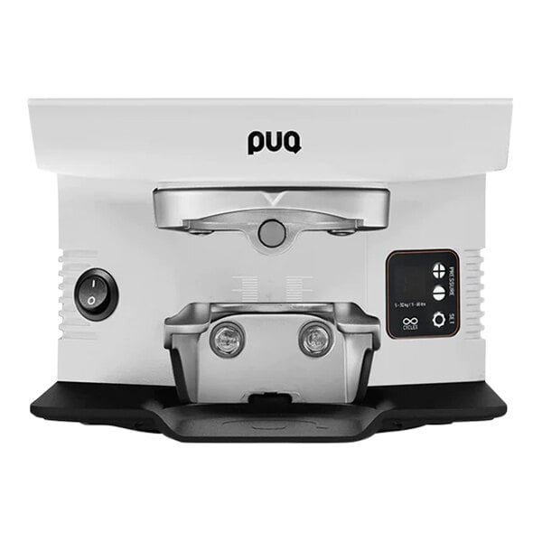 The white PUQpress M6 automatic espresso tamper.