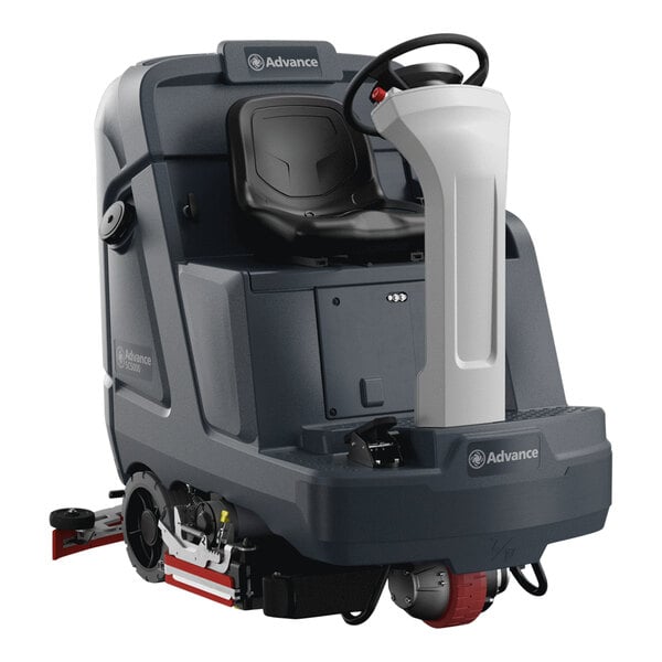 An Advance SC5000 cordless ride-on floor scrubber with a seat and steering wheel.