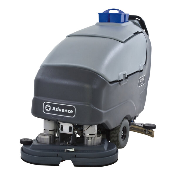 An Advance SC750 cordless walk behind floor scrubber with a blue top and grey bottom and wheels.