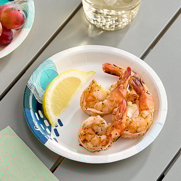 A Choice heavy weight paper plate with a lemon wedge on it.