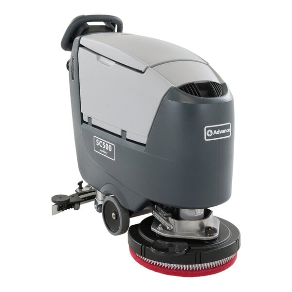 An Advance SC500 floor scrubber with red and black wheels.