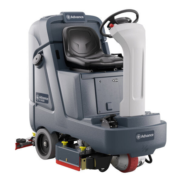 A black floor scrubber with a seat and wheels.