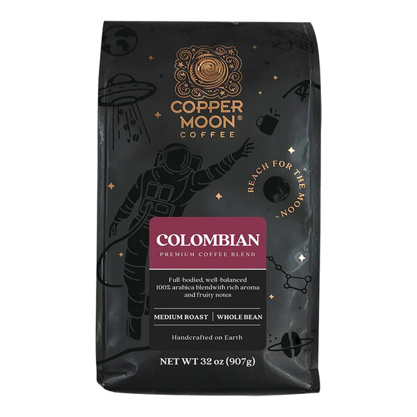 A black package of Copper Moon Colombian whole bean coffee with a picture of a moon.