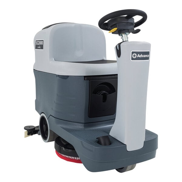 An Advance SC2000 compact ride-on floor scrubber with black and white wheels.