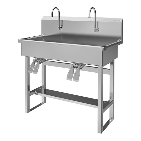 A stainless steel Sani-Lav multi-station floor-mounted sink with double knee-operated faucets.