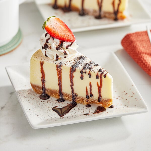 A slice of cheesecake with a strawberry on top.