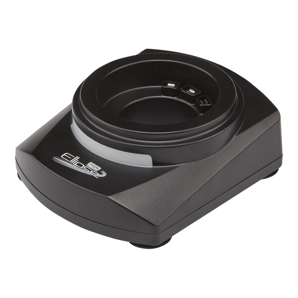 A black Waring Ellipse single charger with a circular base on a table.
