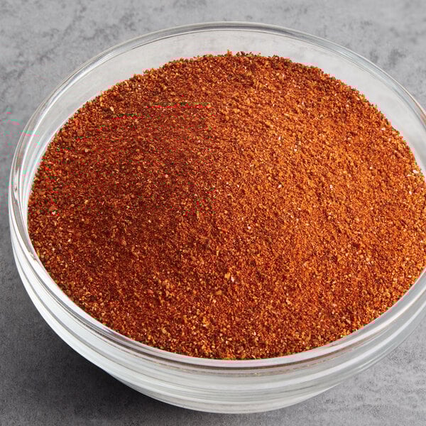A bowl of Regal chili powder on a table.